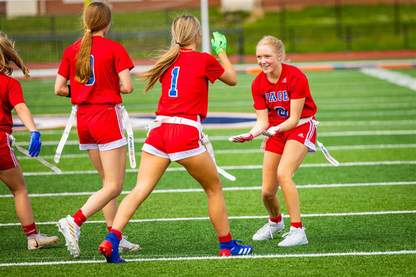 Students play flag football
